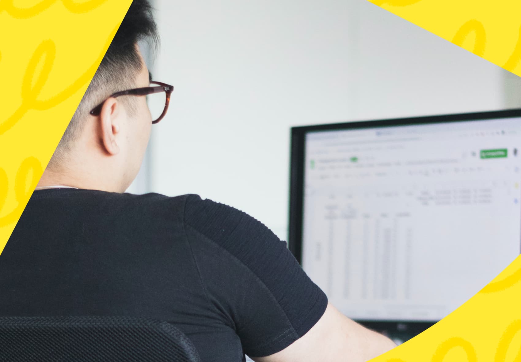 Man sitting in front of a computer screen