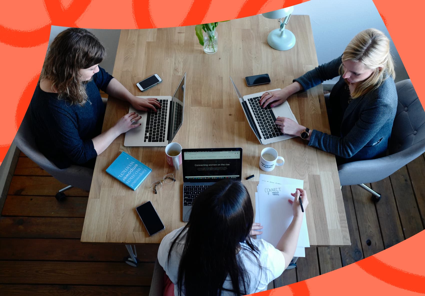 Three woman sitting at desk on their laptops