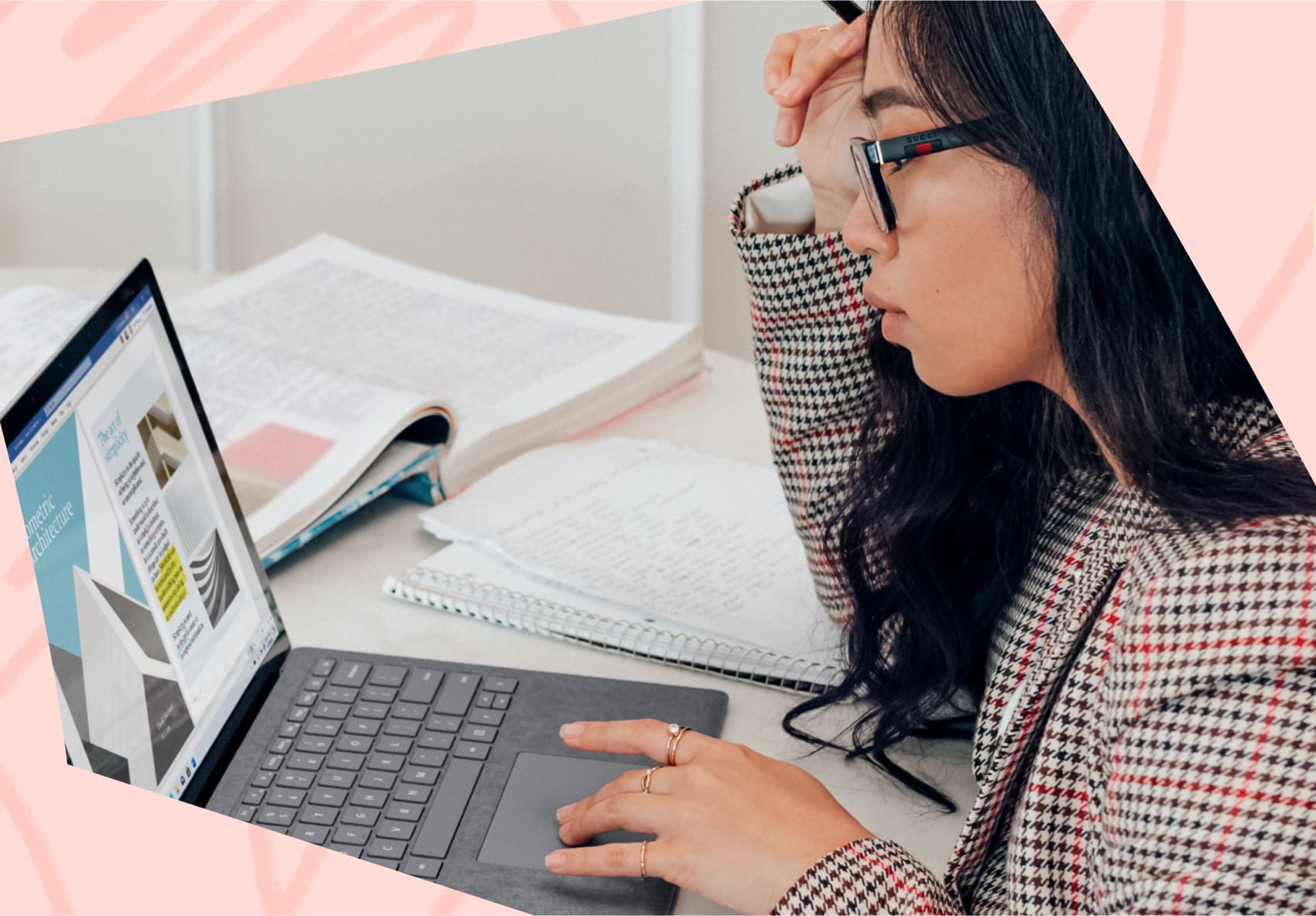 Woman sitting in front of laptop working on marketing project