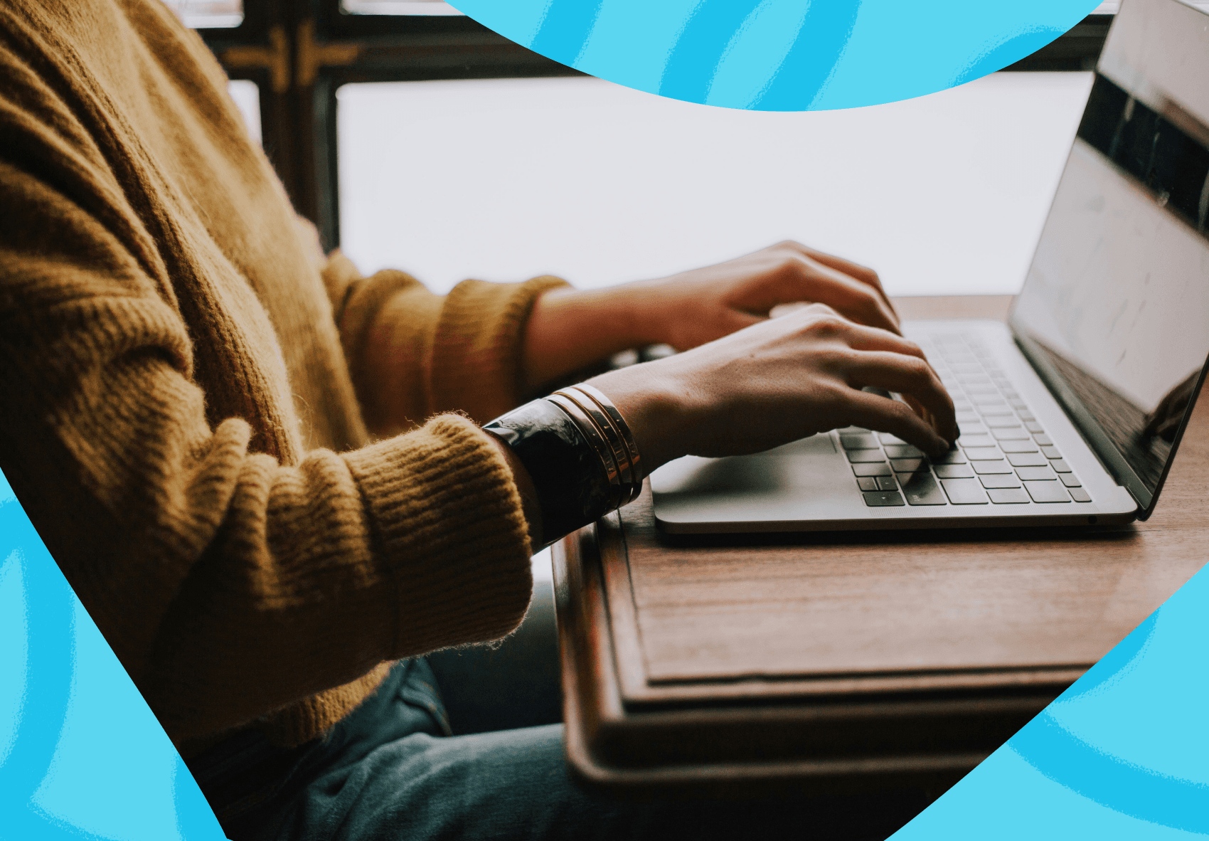 Person typing on their laptop